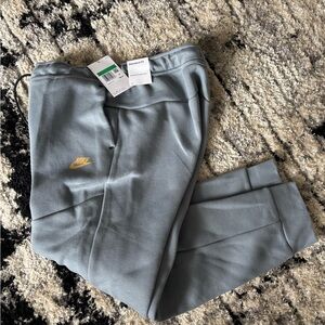 Nike Tech Joggers Gray Sweatpants with Gold Logo